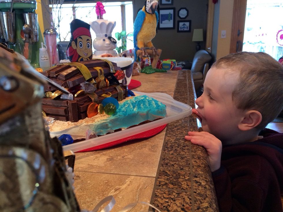 Reveal to the birthday boy! Check out his reaction and realize that you've fully earned any nibbles you may have enjoyed along the way!