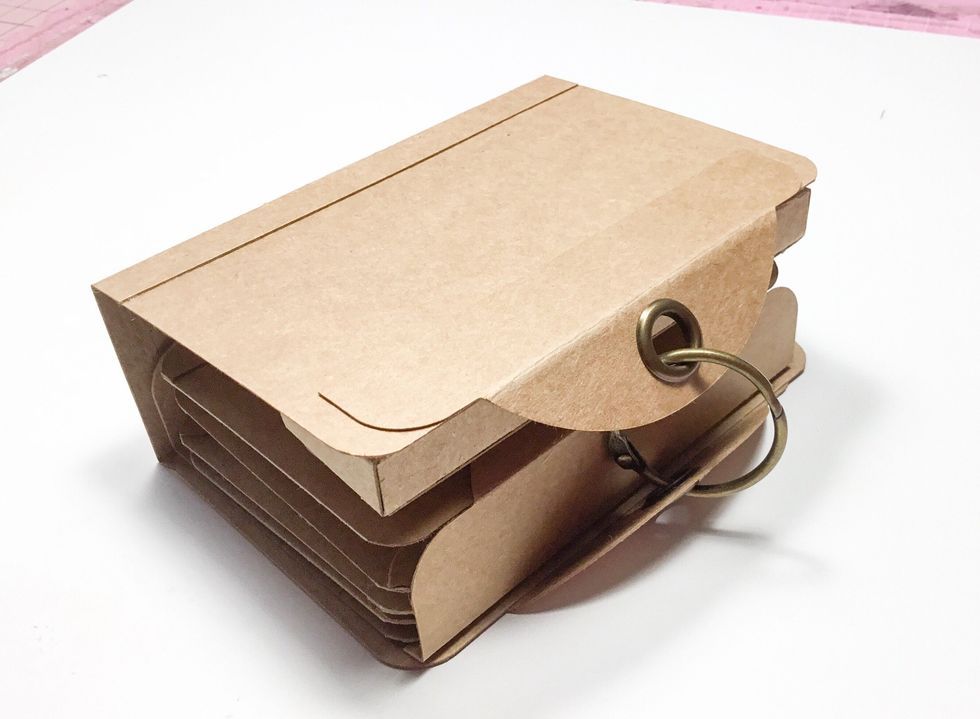 Ribbon could be used instead of the binder ring to hold the album closed.