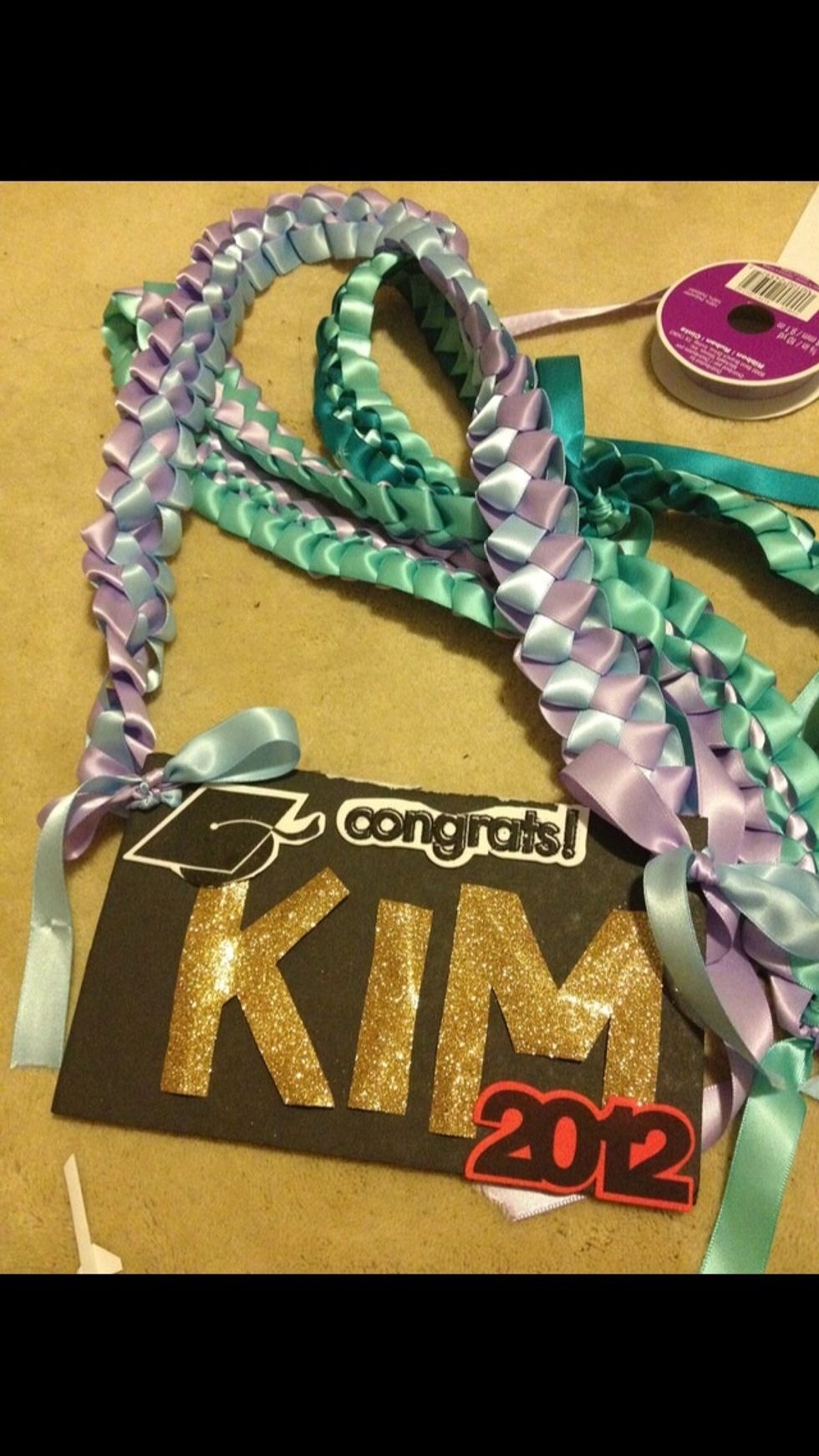 Ribbon lei with personalized name card! This was made in 2012... I bought all materials from Michaels!! Foam board/sheet or poster board was used for the name card.