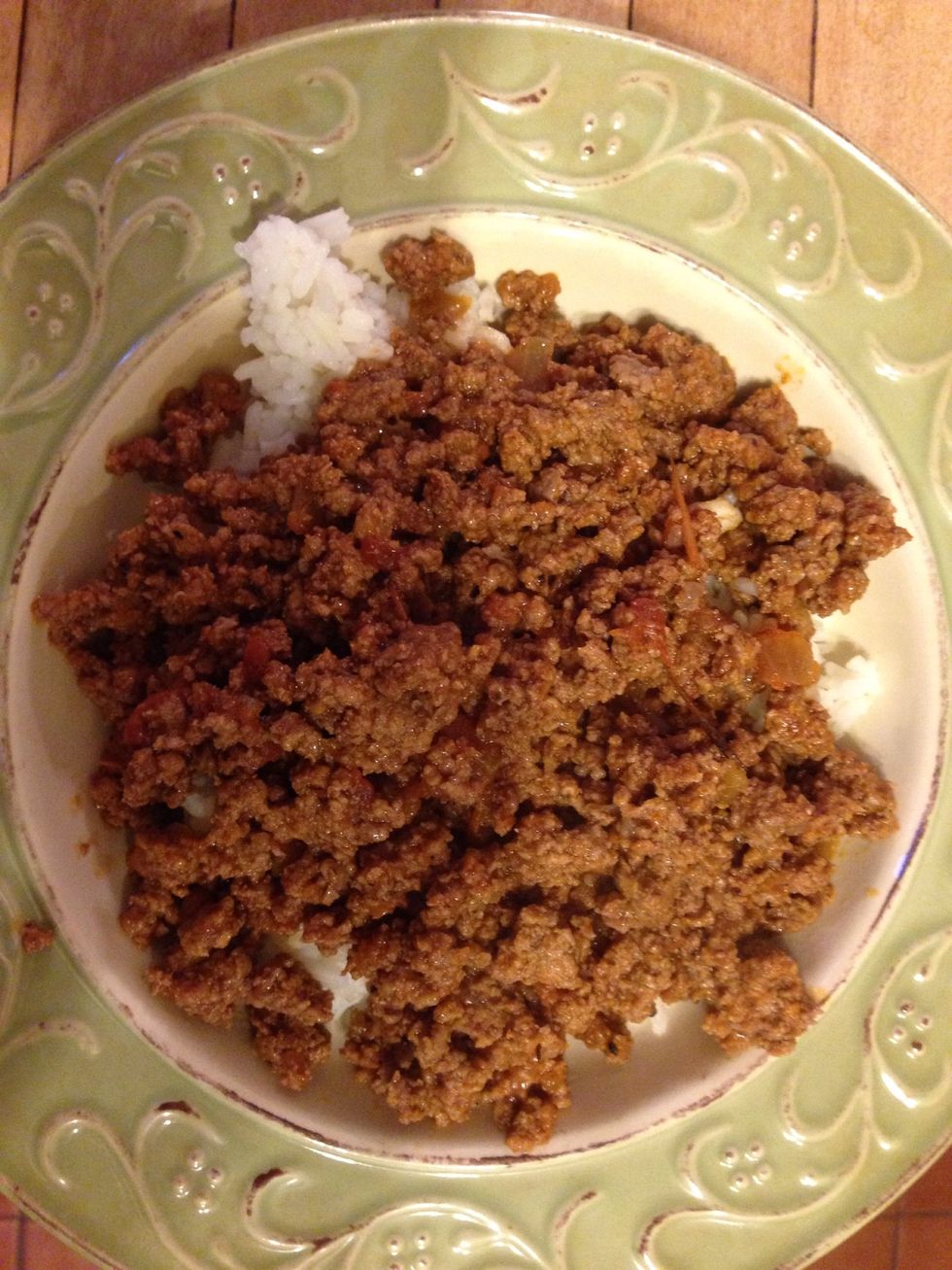 Rice is first on the plate. Then add the beef.