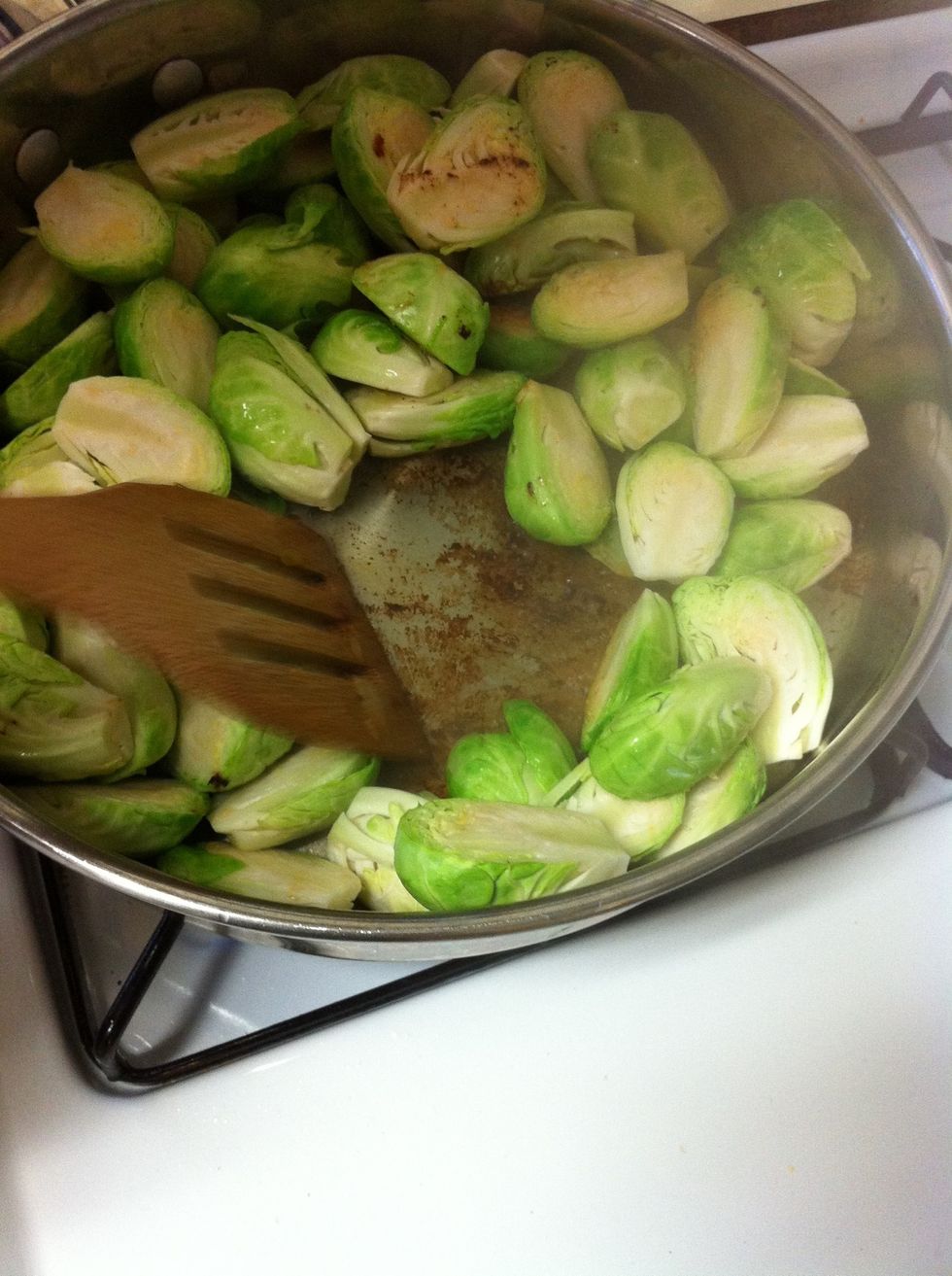 Right after adding the chicken broth, use a wooden spatula to scrape off the fond on the bottom of the pan. After, cover with a lid to help steam cook the sprouts.