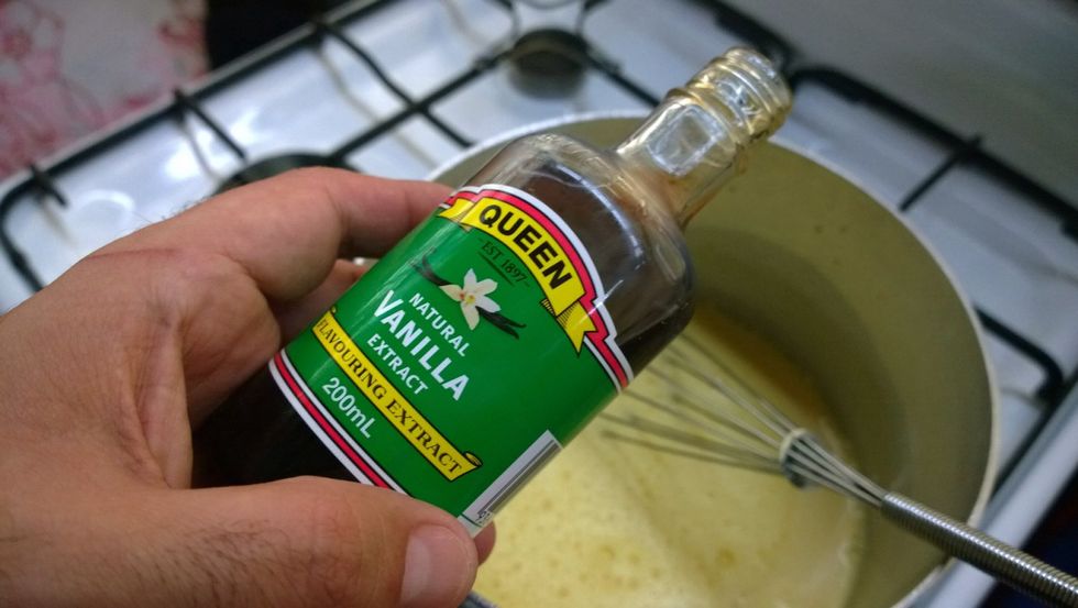 Right at the end, just as your custard thickens and you've turned off the stove, add 4 teaspoons of vanilla essence.