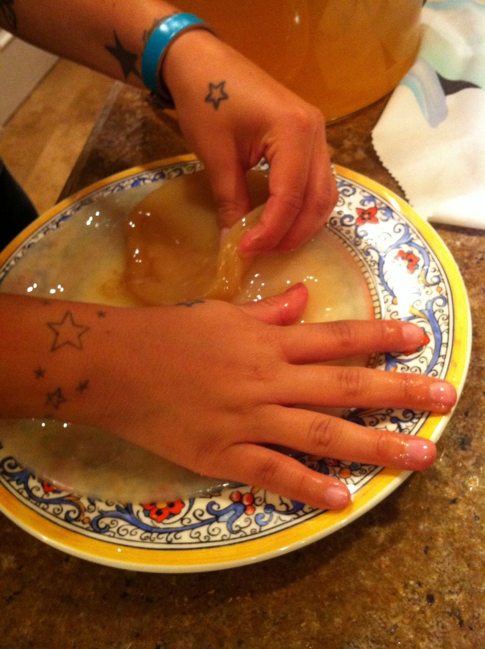 Right before I bottle I took out my scoby. The little one I'm peeling off is my starter and that big guy underneath is my new buddy. I love him!