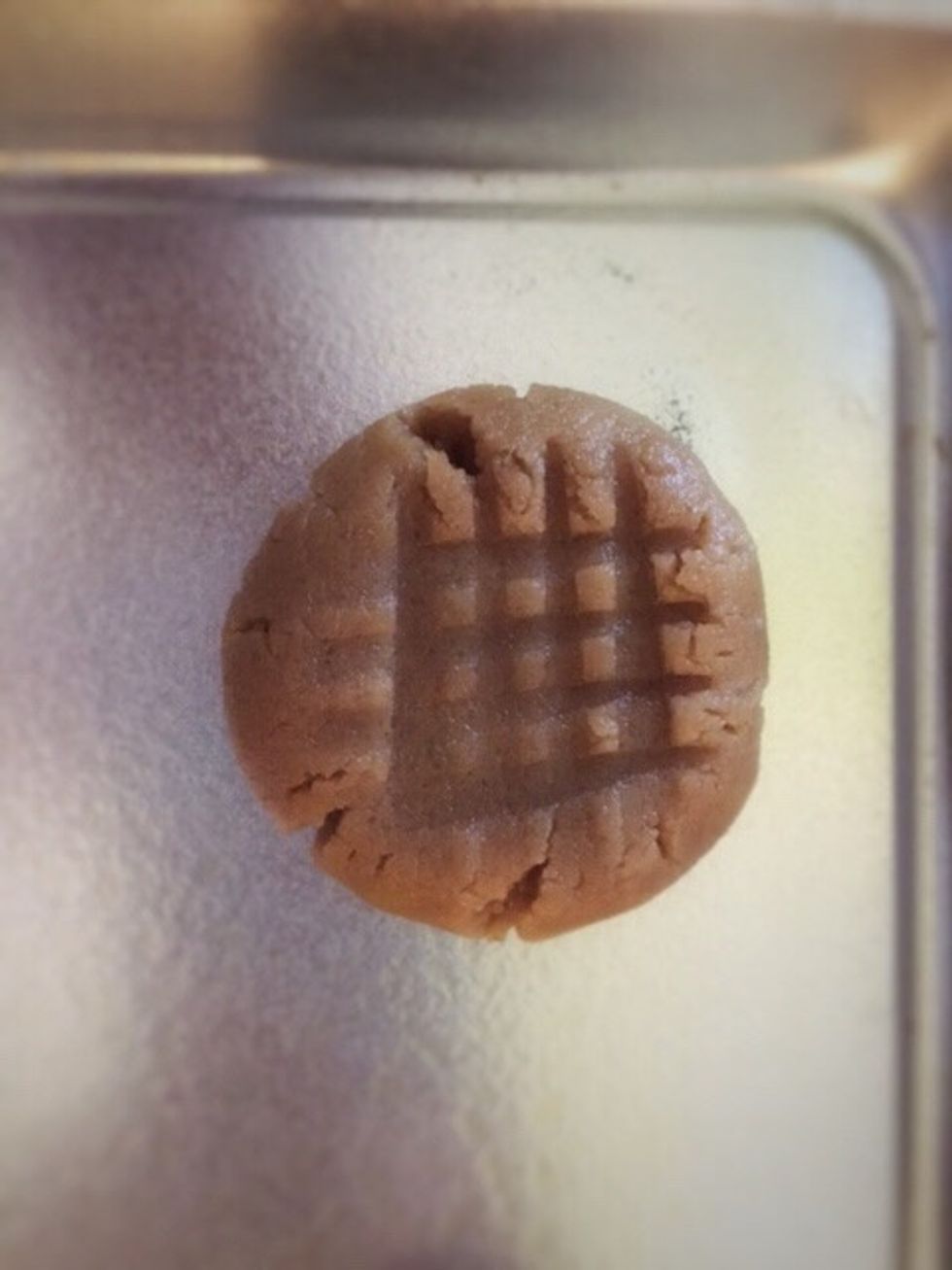 Right before putting the cookies into the oven sprinkle the tops of them with sugar.