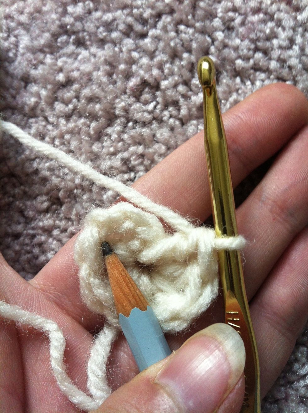 right now i'm not counting the chain. therefore i do 6 double crochets in the ring. to join the round to it's beginning you insert the hook in the first top of the double crochet...