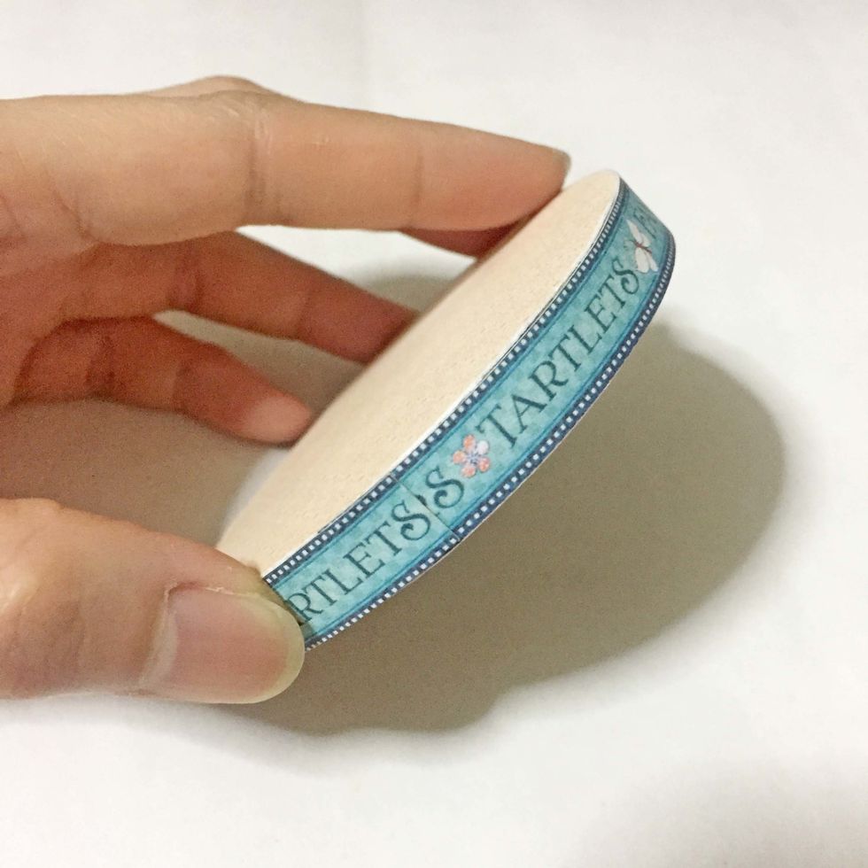 Rim it around using a strip of your choice from the paper collection and cover the top with some pattern paper.