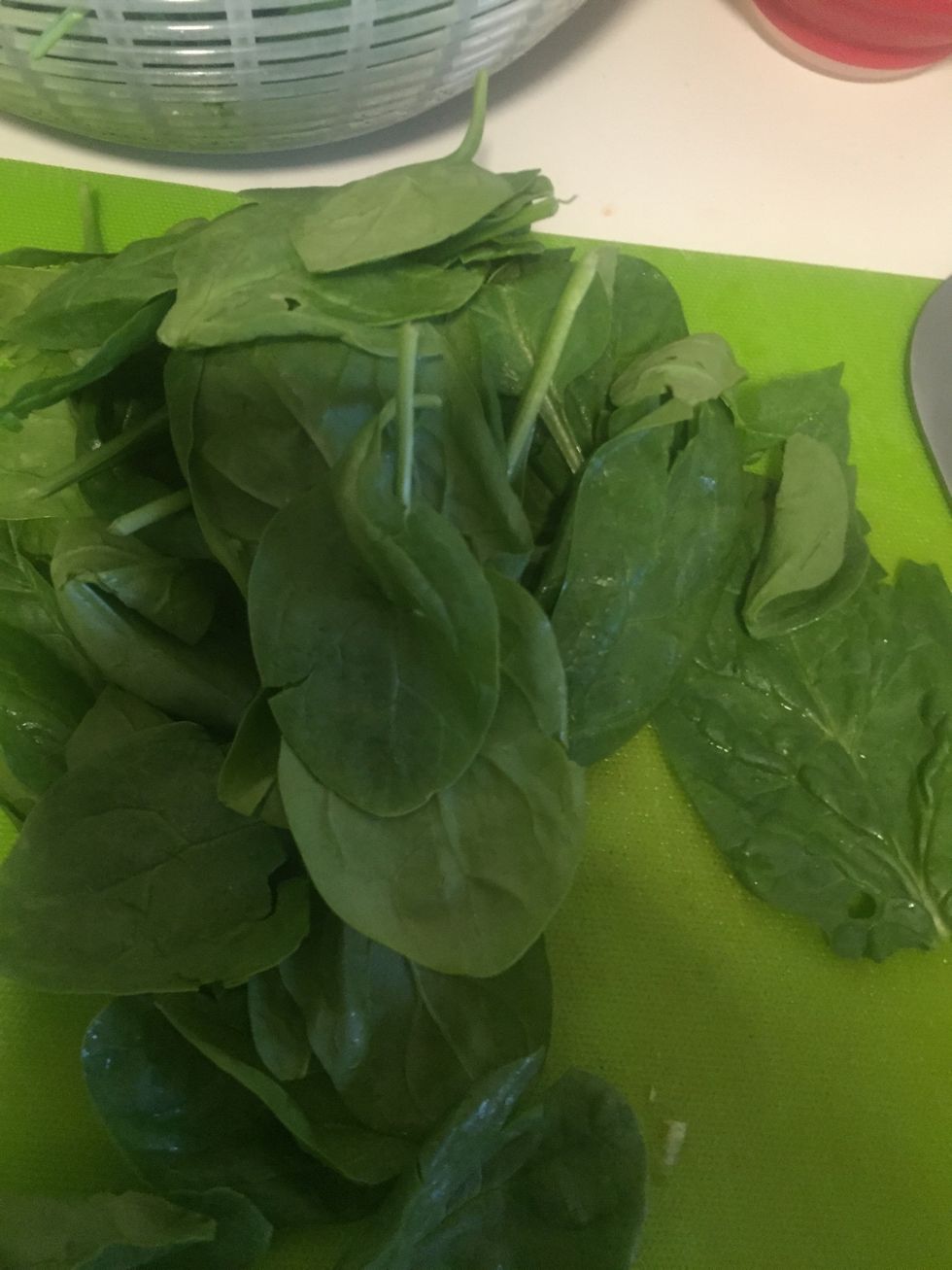 Rinse about 1/2 cup of spinach and chop it