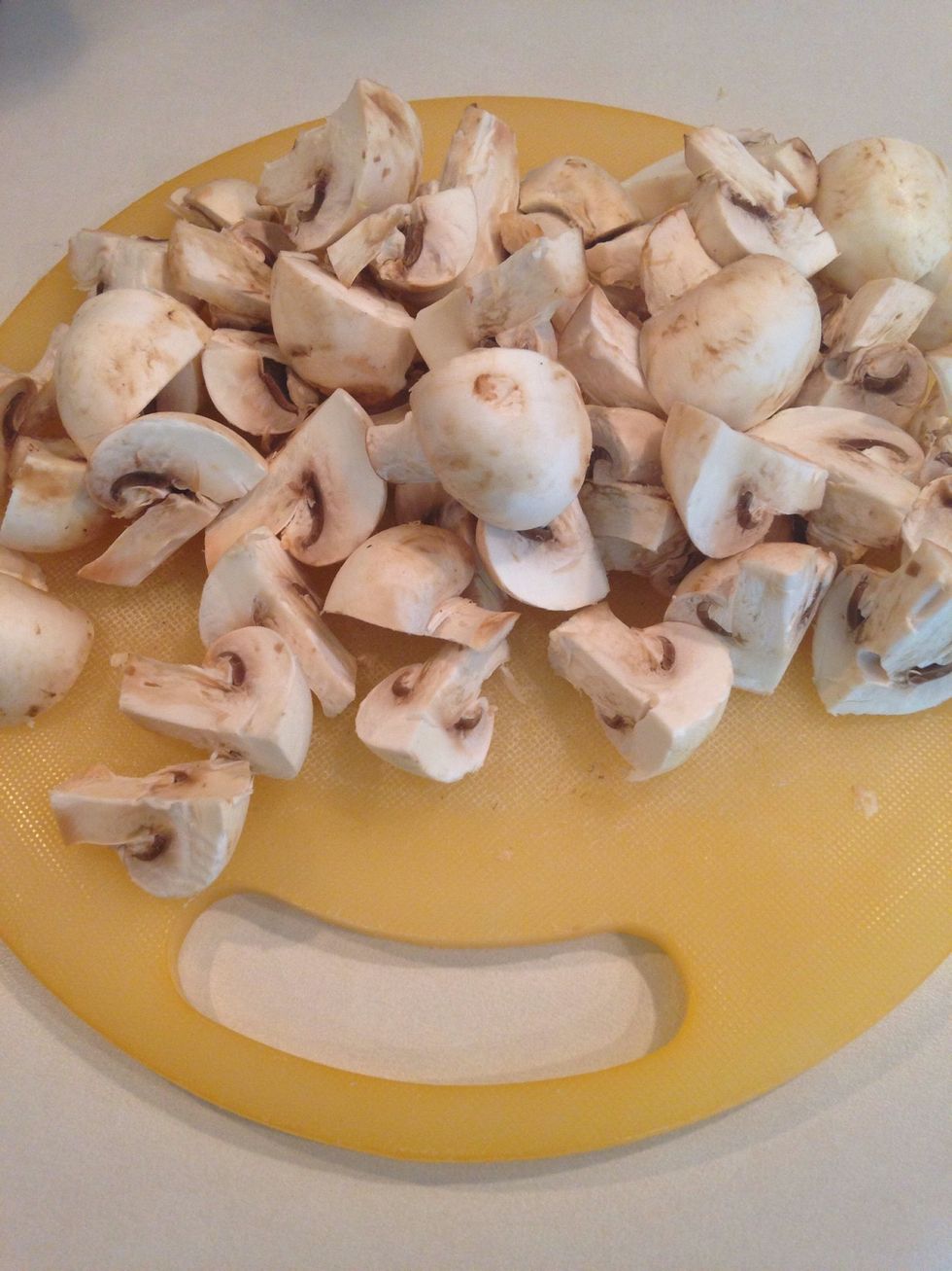Rinse and pat dry mushrooms. Slice in quarters.