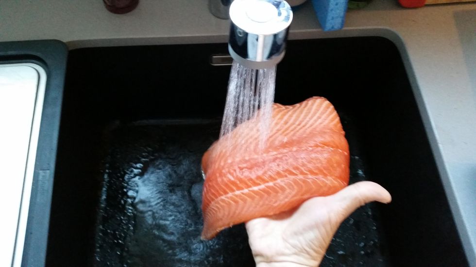 Rinse and pat dry salmon fillet then cut into serving-size steaks.
