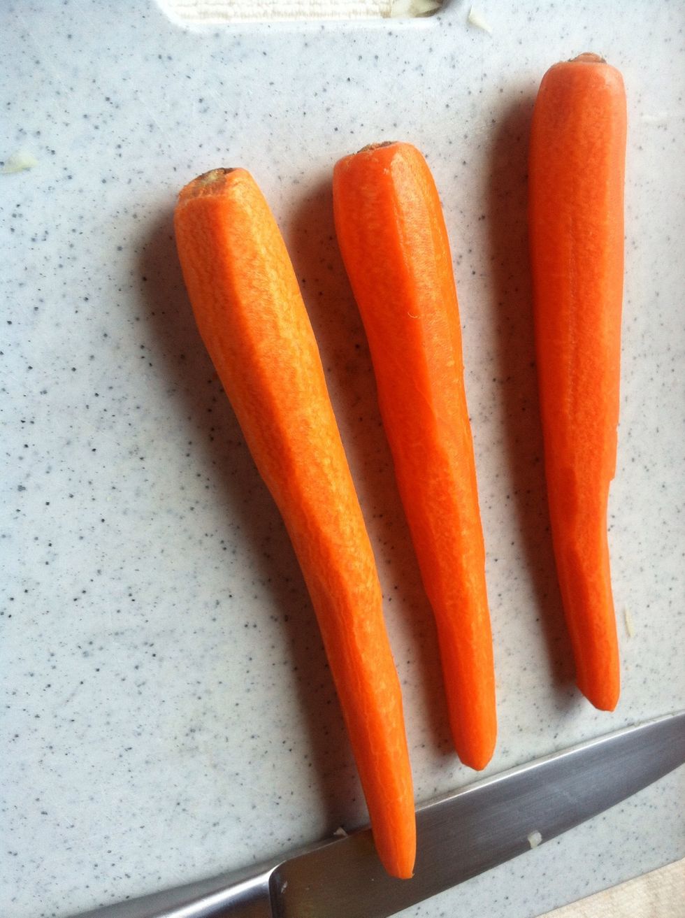 Rinse and peel carrots then chop up into small pieces
