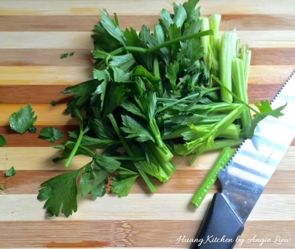 Rinse and shake dry the coriander leaves. Then using a sharp knife, cut into 2 inch strips, starting from the leaves to the stems. And we're ready to fry the mushrooms.