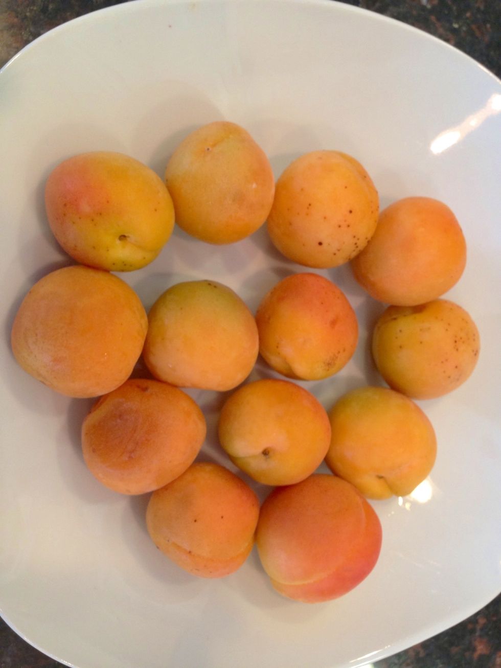 Rinse apricots and slice in half, removing the pit.