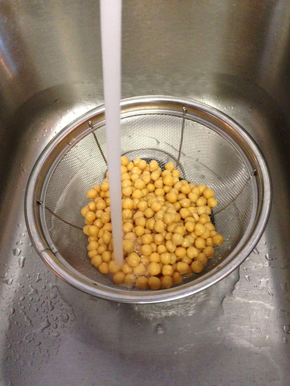 Rinse garbanzo beans in strainer under cold water.