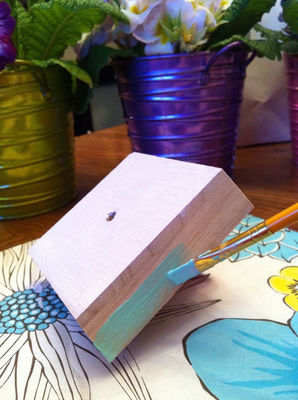 Rinse the brush under warm water to remove residue from previous color and start painting the sides of the lid with Beach Glass. Because the pigment is so bright one coat will do.