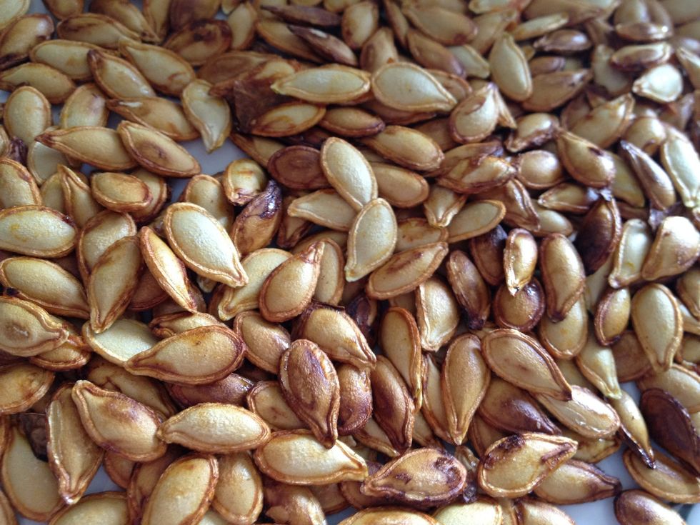 Rinse the pumpkin seeds and remove the membrane that attach the seeds. Bake the seeds for 15 minutes, until surface is golden drown and dry. Skip this step and replace with other nuts or seeds.