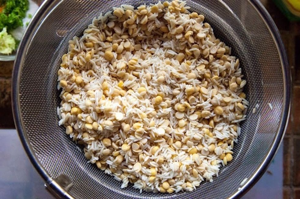 Rinse the rice and the dals and soak them in a bowl of water for about 6 hours. Drain the water from the rice and dal.