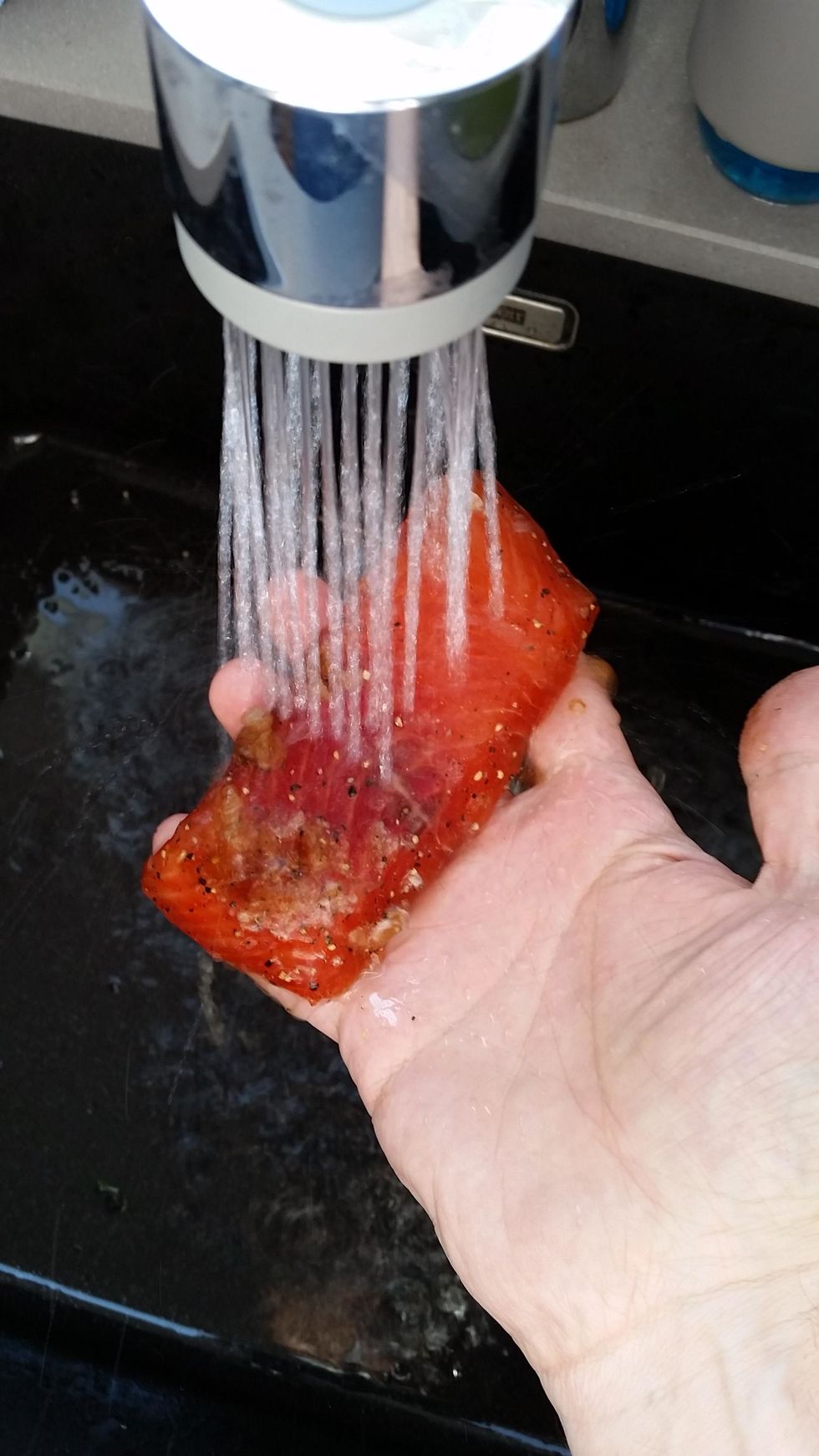 rinse the salmon pieces under cool running water, thoroughly removing the brine.