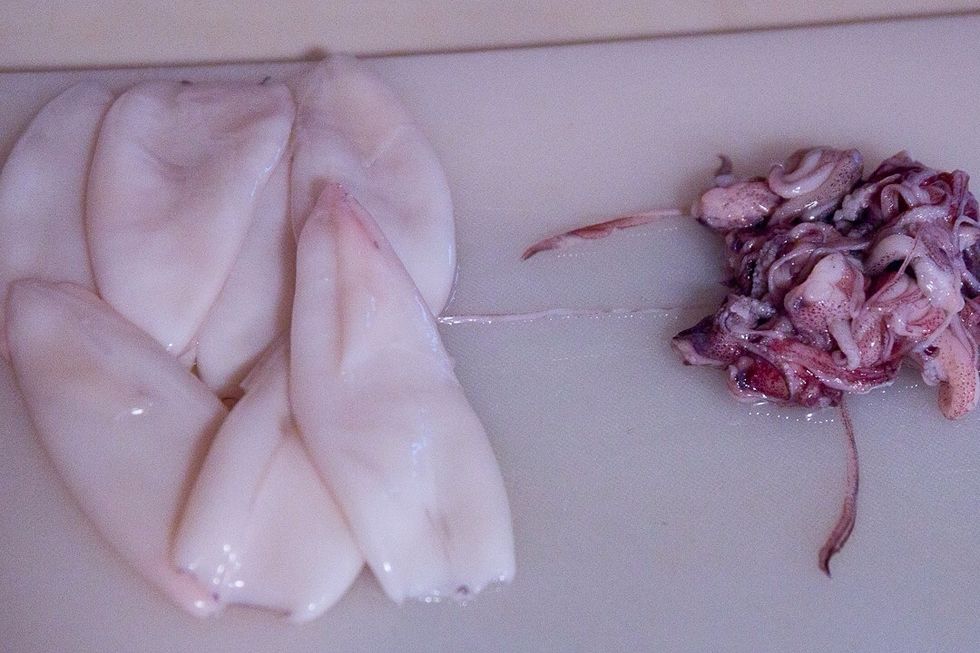 Rinse the squid and check the tubes for any hard bits. I also like to cut the two long tentacles off of the legs. I don't know of they are really legs but they sure look like em.