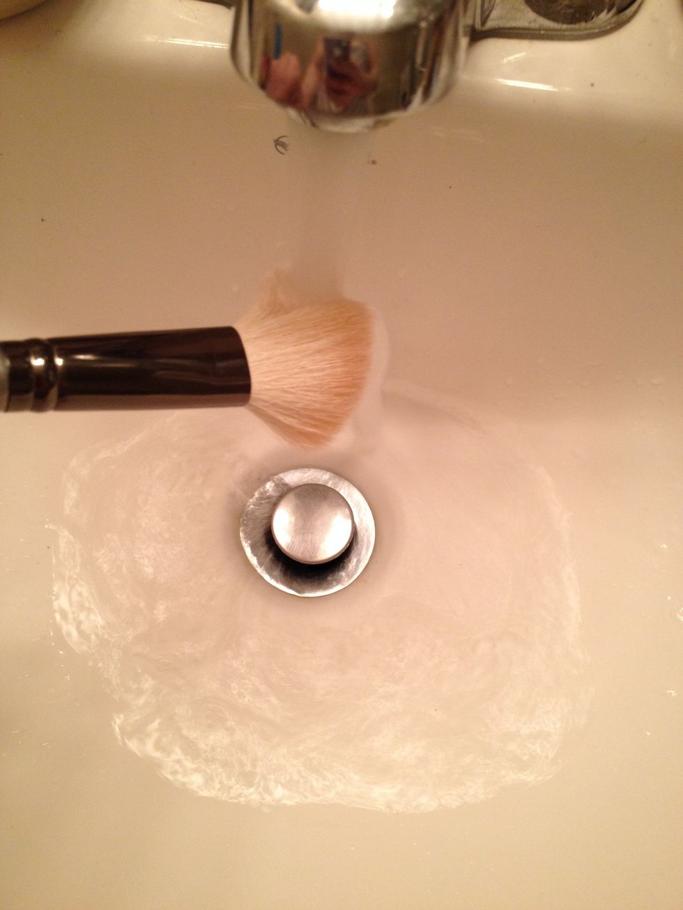 Rinse using lukewarm water, keeping brush at a downward angle.  Gently use your fingers to help loosen any build up, if necessary.