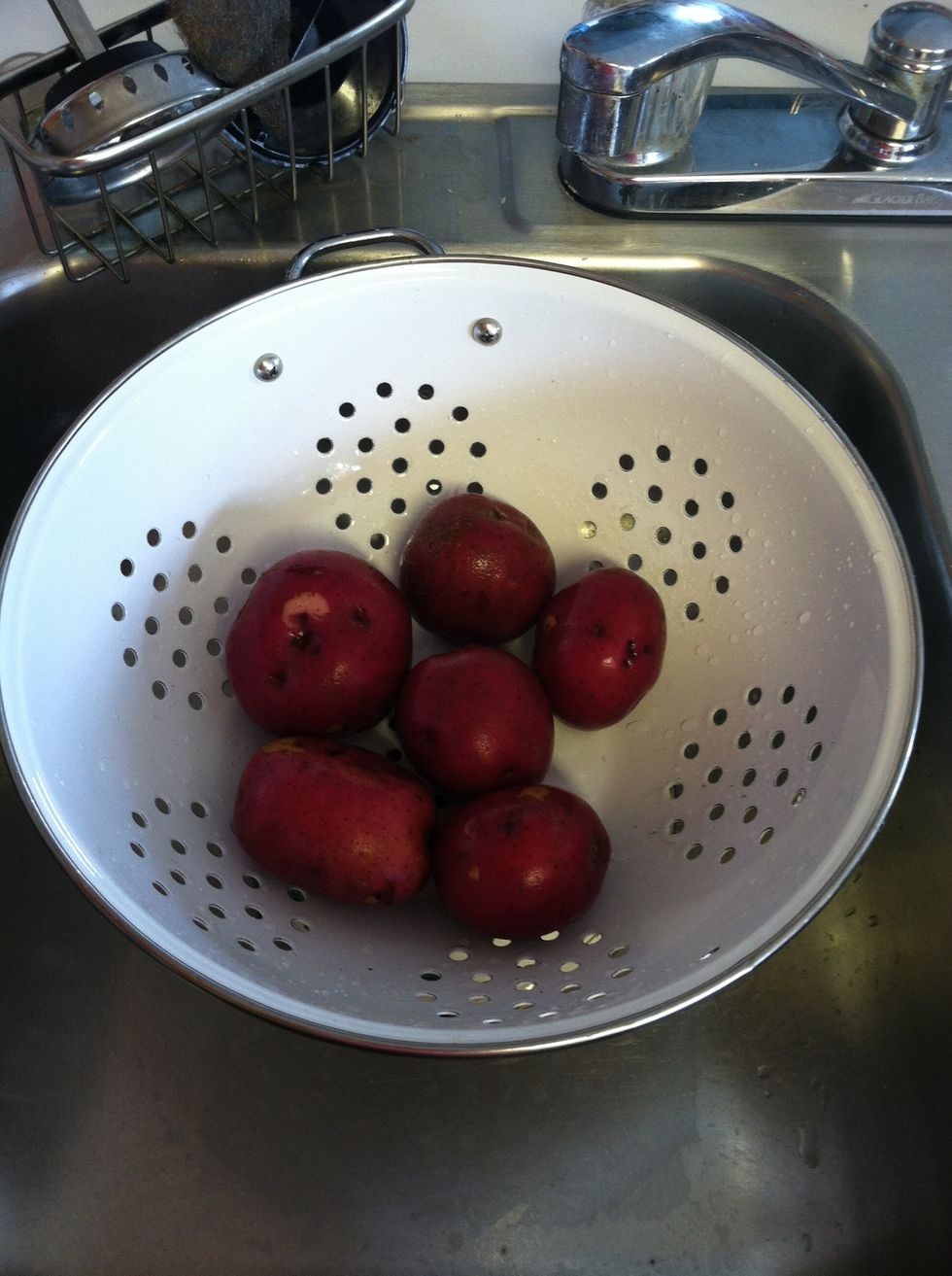 Rinse your potatoes under cold water.