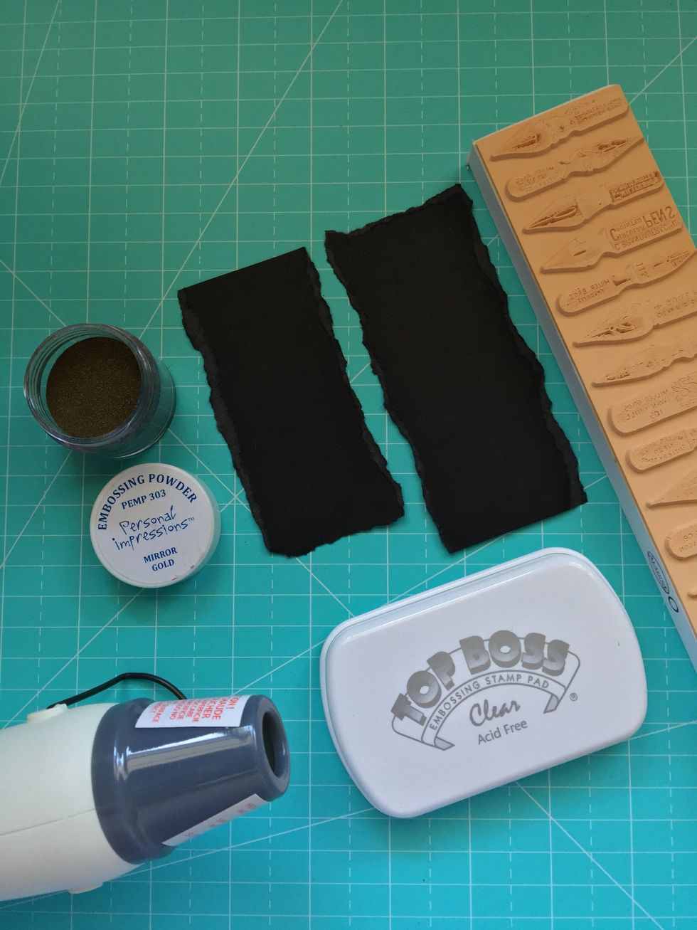 Rip come pieces of black cardboard. To make embossing we will need embossing stamp pad, stamps, embossing powder and a heat gun.  Wet the stamp on the pad. Add embossing powder.