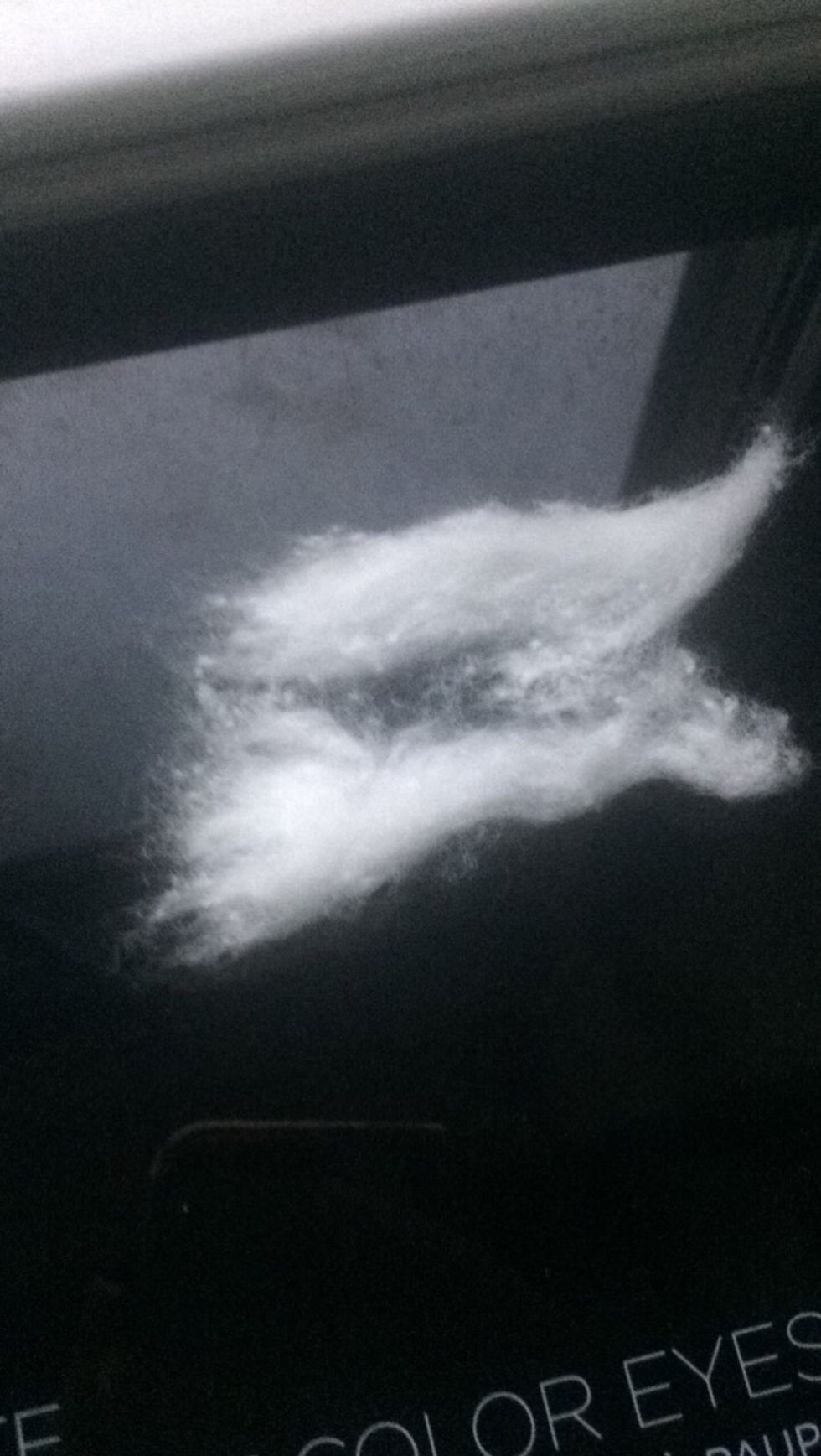 Rip off a piece of the cotton ball.