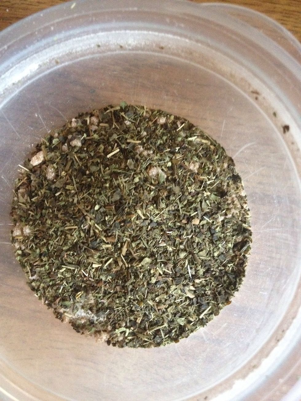 Rip open a green tea bag and add the leaves.