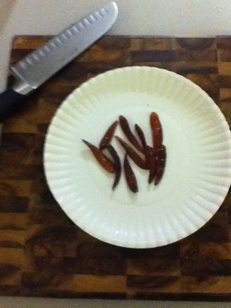 Rip some dried red chiles into pieces and set aside. I like to use ten, but you can use less if you are some kind of pussy.