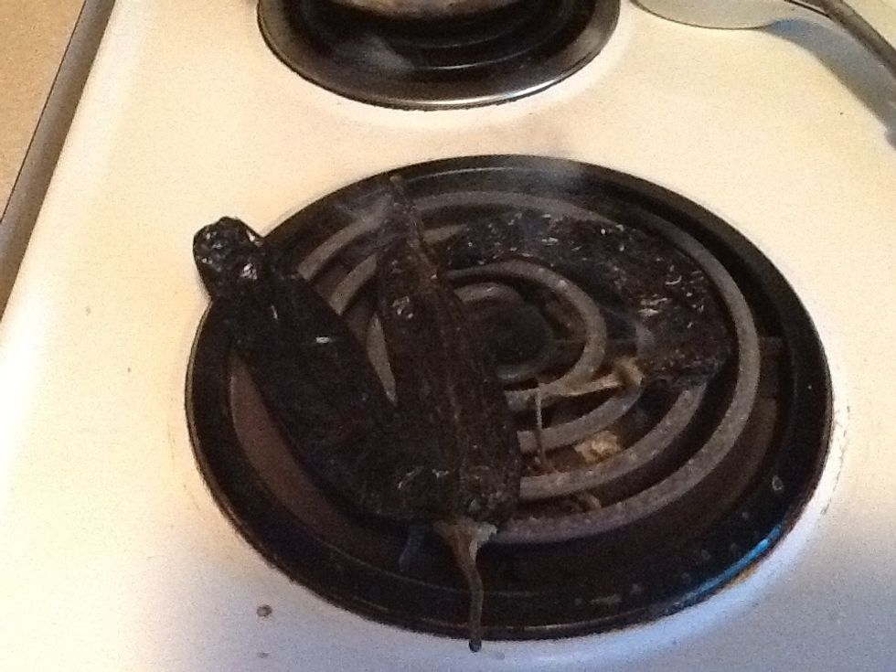 Roast black chiles on stove like this