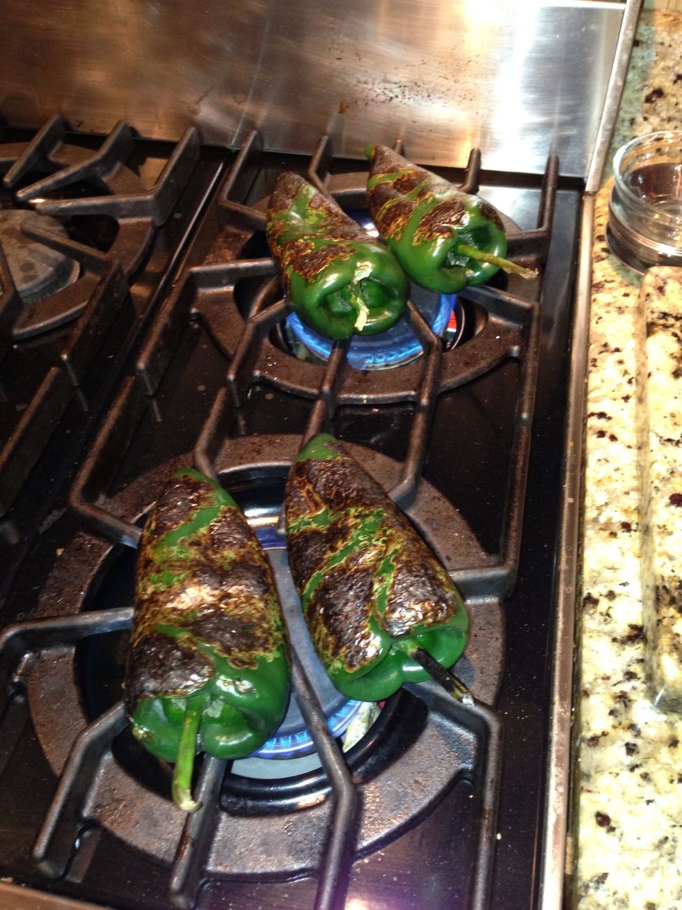 Roast both the poblano and jalapeno peppers and seal in plastic bag and allow to steam for 10-15 minutes. .