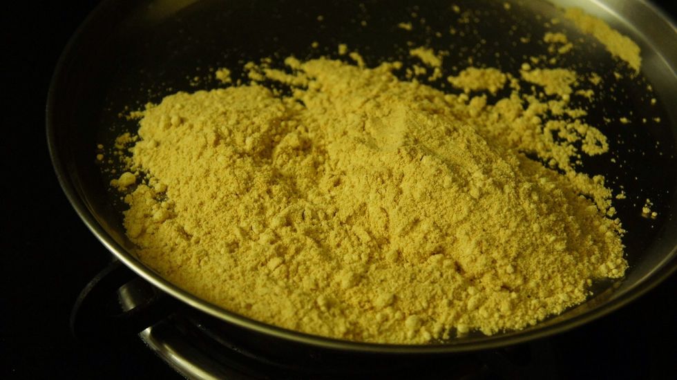 Roast the gram flour in medium flame, make sure you need to stir it continuously otherwise the flour will burn.