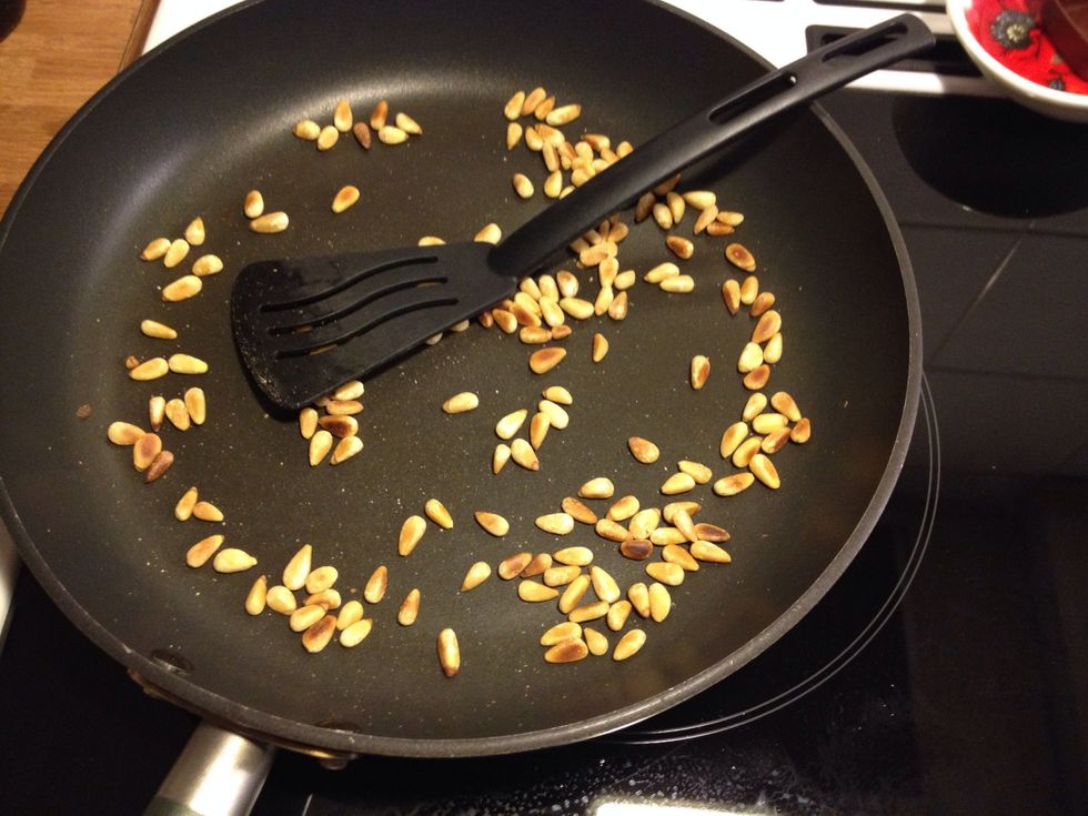 Roast the pine nuts in a frying pan/skillet.
