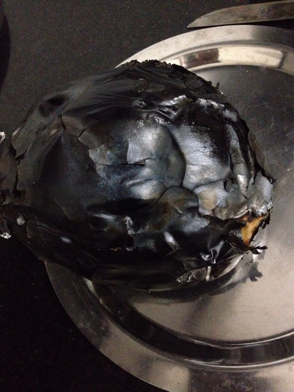 Roast till upper skin is charred and inside its cooked and mushy