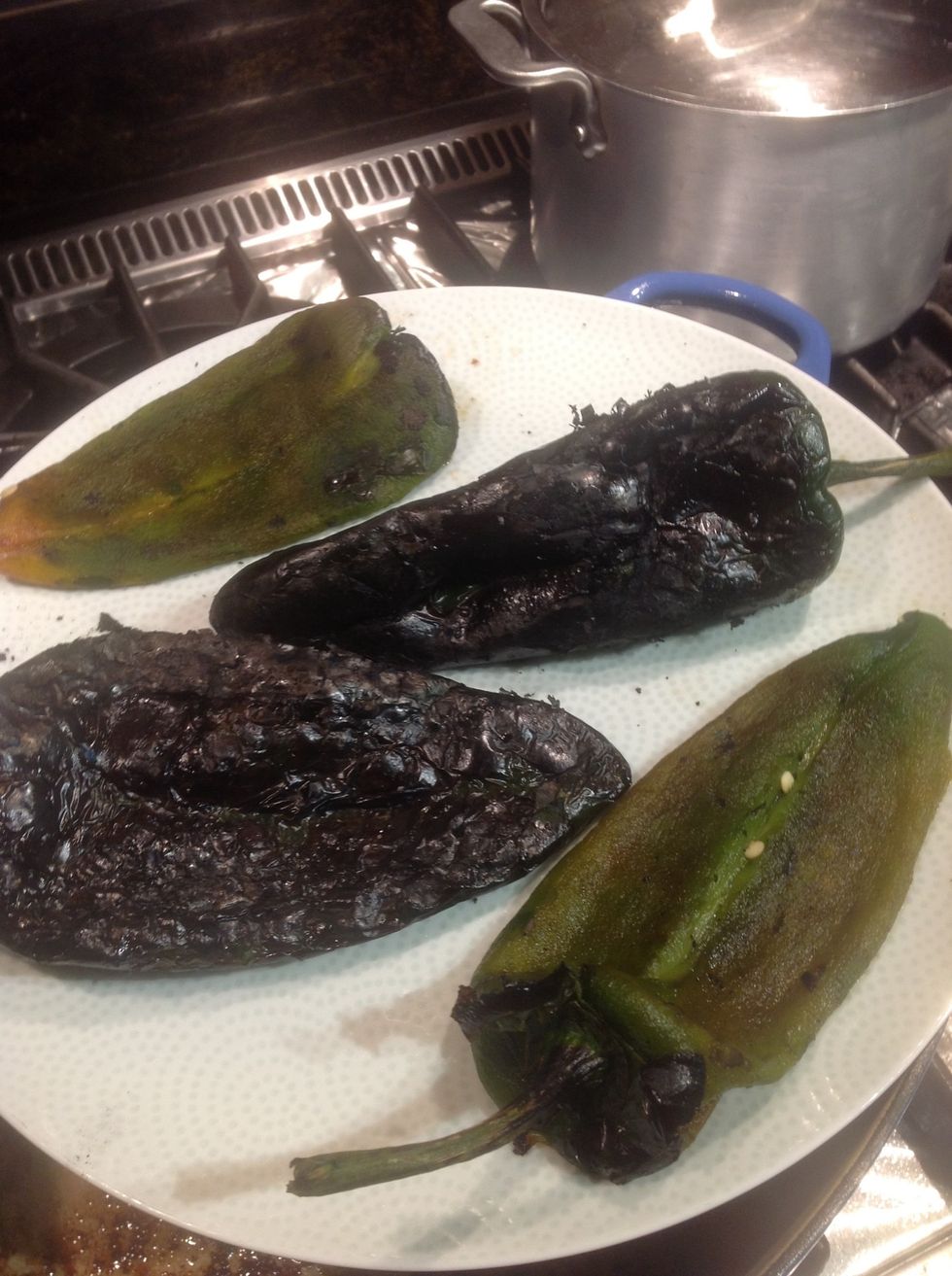 Roasted and peeled chilies side by side.