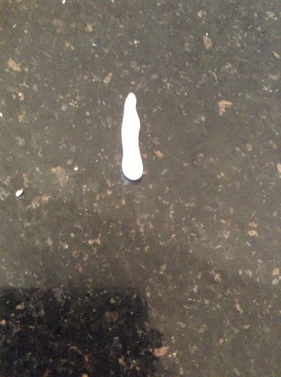 Roll a little bit of white clay into a straw shape