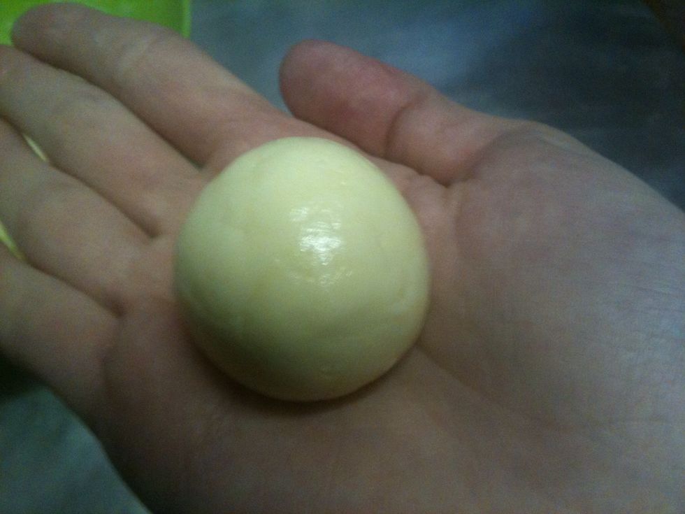 Roll a piece of the dough into 1 inch ball in the palm of your hand