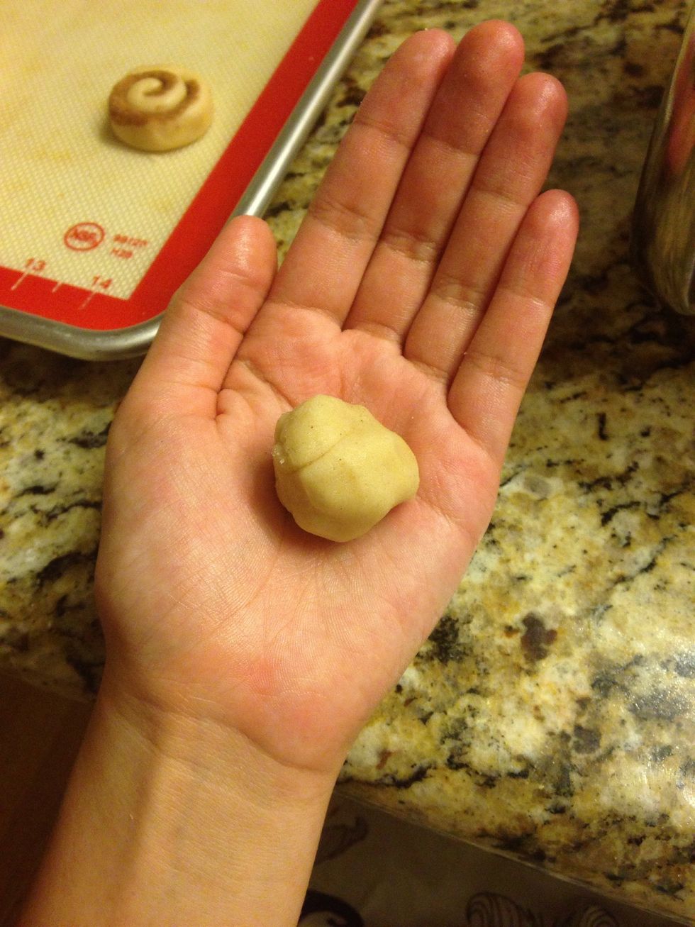 Roll a tablespoon sized ball. (If the dough seems too crumbly or crumbles in the next step, add more milk).