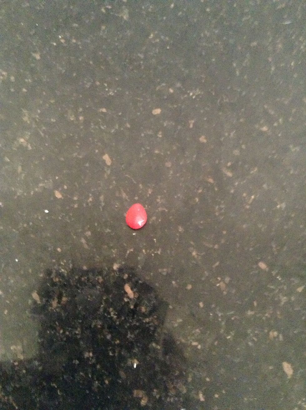 Roll a teeny bit of red clay into a ball