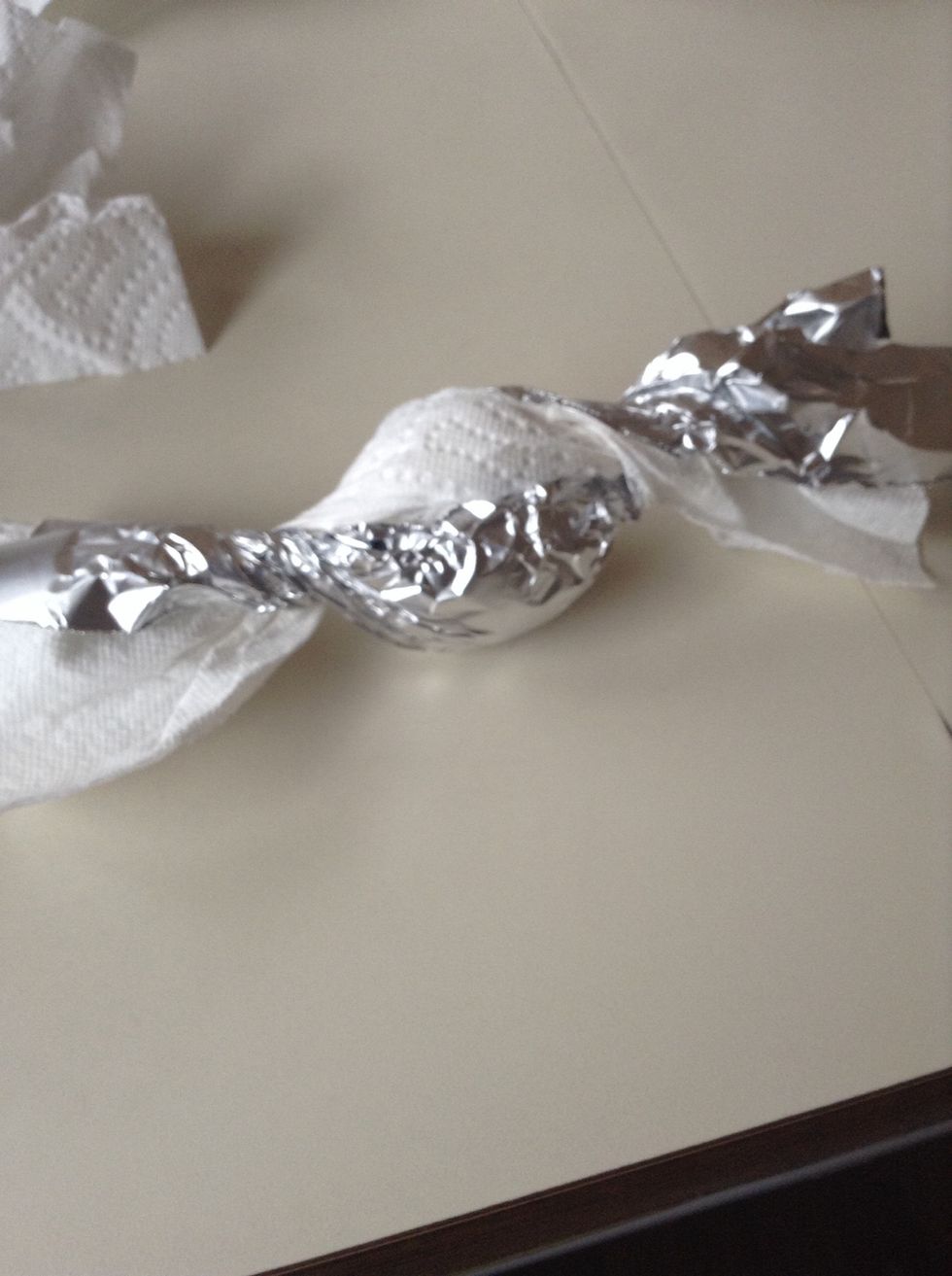 Roll an egg up like a candy in the paper towel then around the paper towel in order to keep its shape wrap it in tin foil
