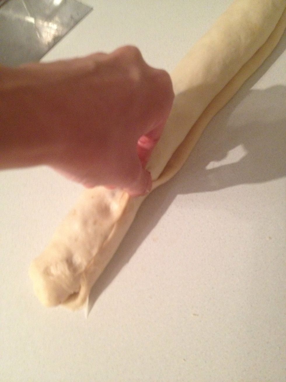 Roll and punch the dough like so. The cut into disc about 2" thick.