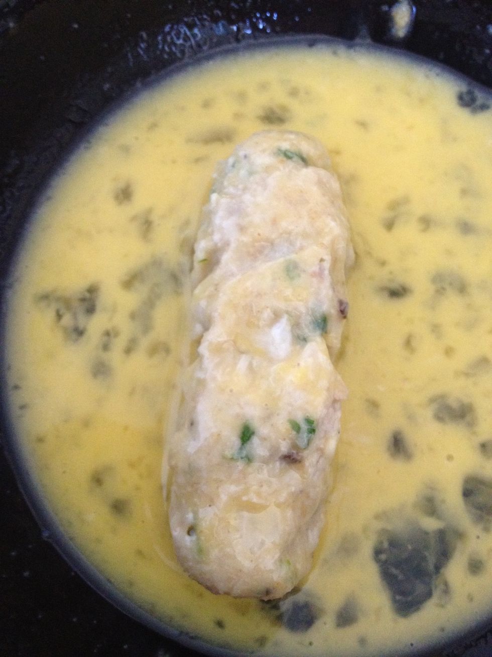 Roll around until it's completely covered in egg.