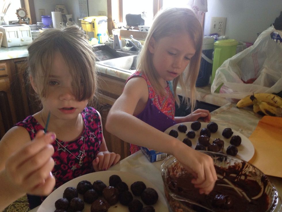 Roll cake balls in the melted chocolate (we are going to make sure to put wax paper down on plate as they really stuck to just the plate)