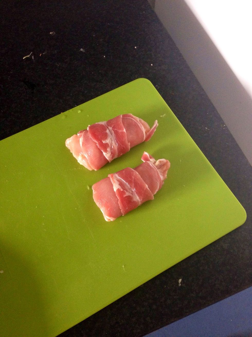 Roll chicken in bacon