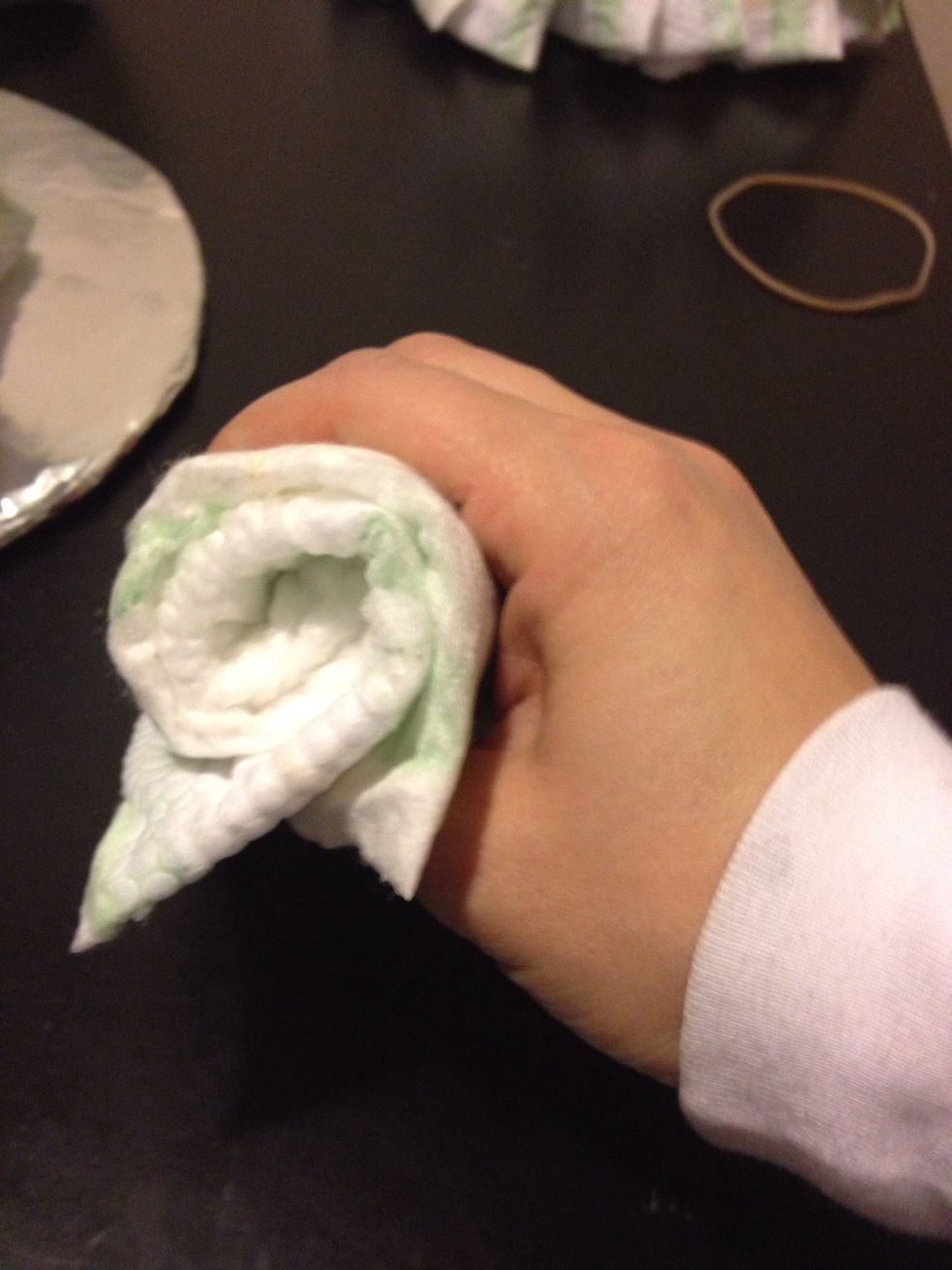 Roll diapers & wrap with rubber band.