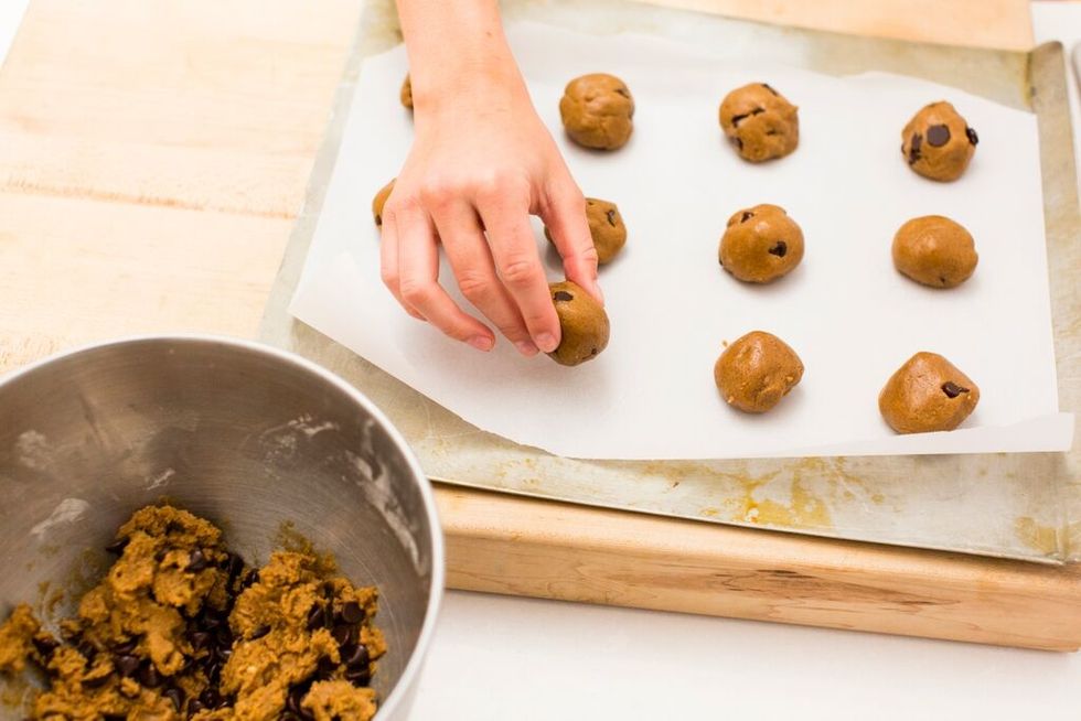 Roll dough into 1 inch balls and place on cookie sheet.