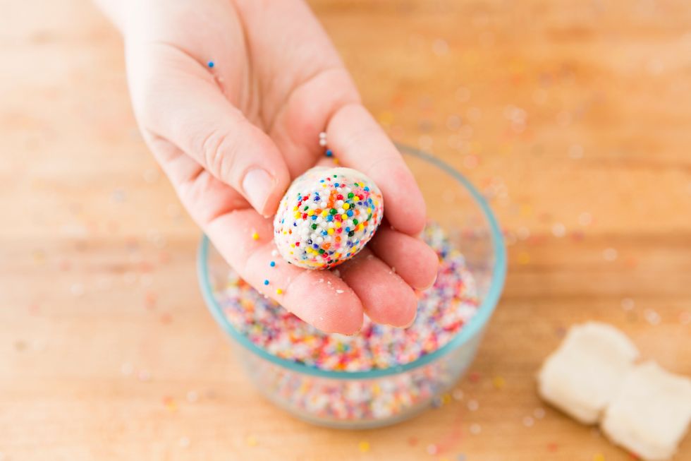 Roll each ball in the sprinkles, working the sprinkles into the dough and then shape into a ball again.