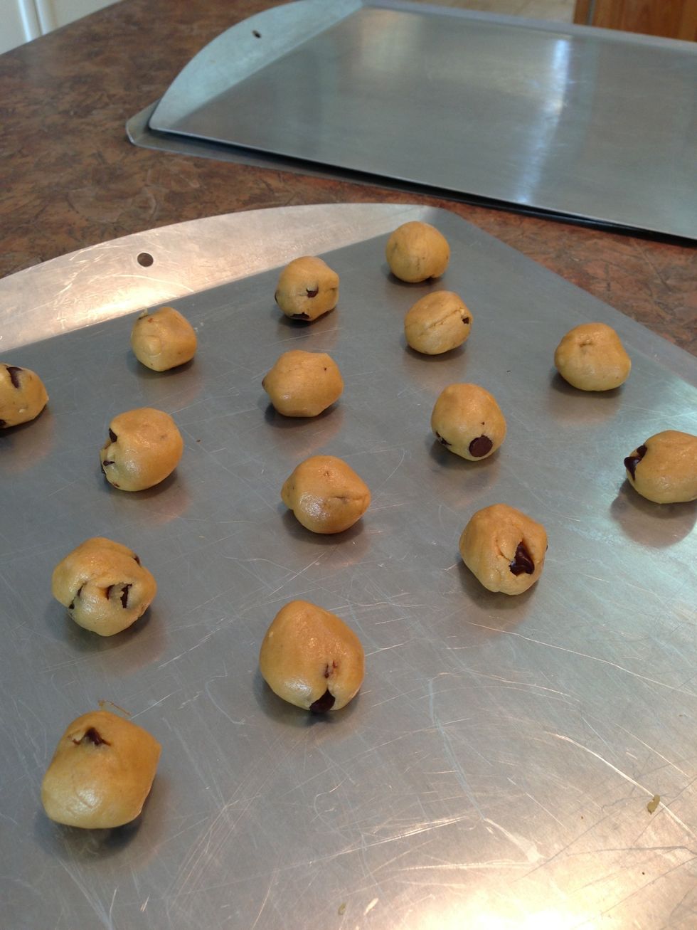 Roll each one by hand. Place on cookie sheet.
