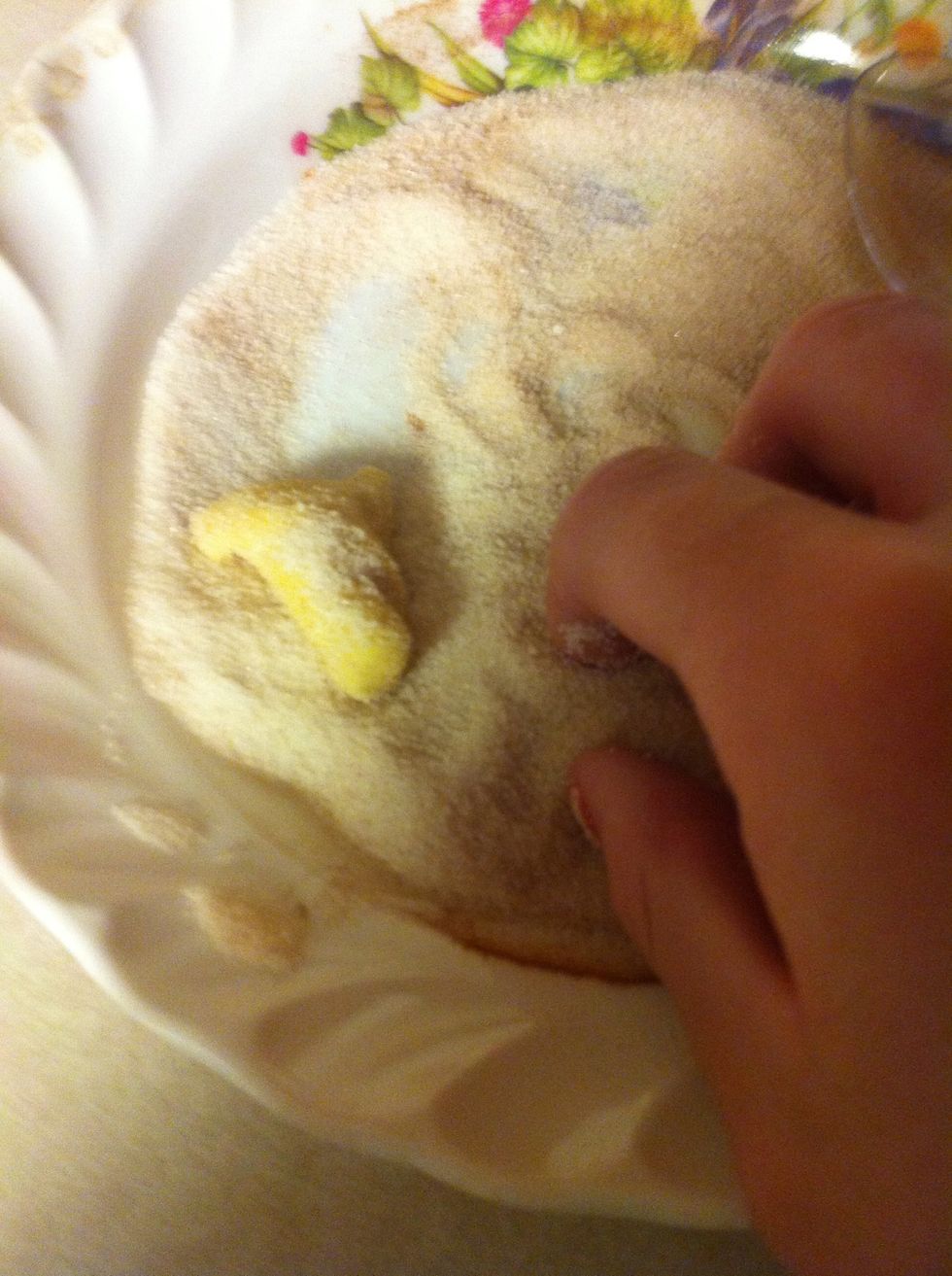 Roll each piece around in the sugar/cinnamon mix until it's coated on all sides.