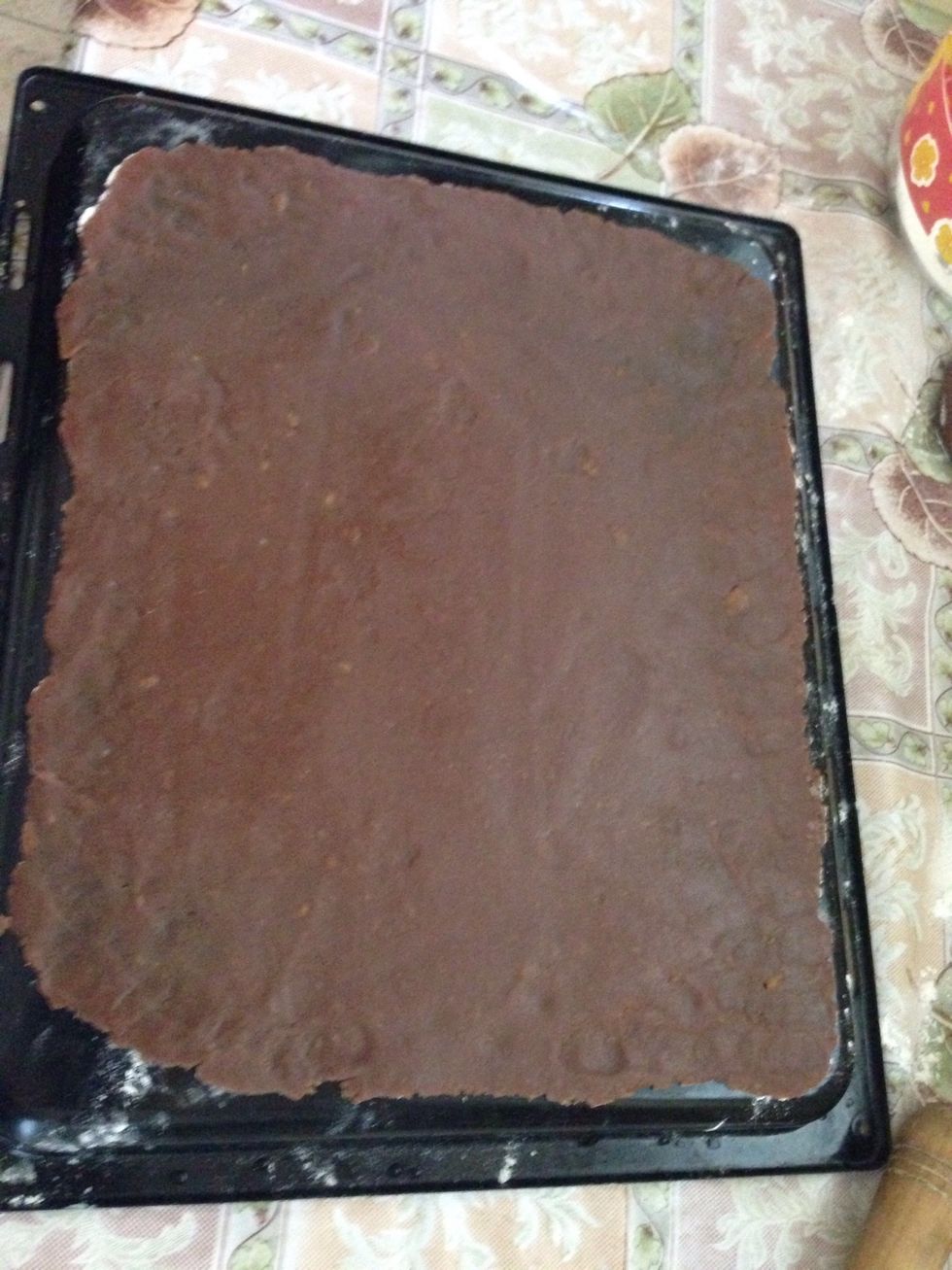 Roll each piece into a large rectangle shape, put into a flat tray(dusted with a little bit of flour) and bake at 180c preheated oven for 6-7 minutes.