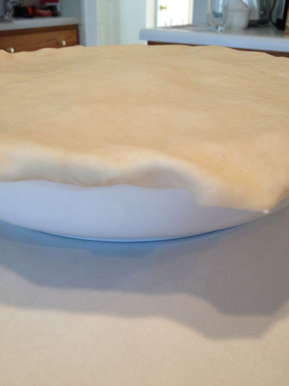 Roll edges so that both the bottom and top crusts join together.